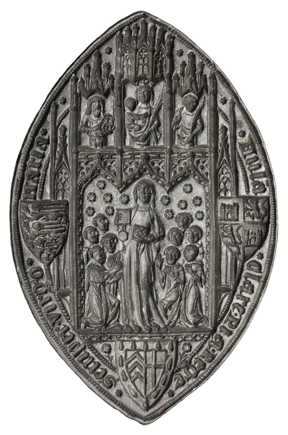 The silver matrix, a pointed oval with intricate design described below, the photo flipped so that the inscription reads correctly